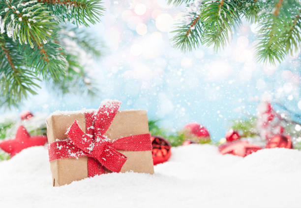 istock Christmas greeting card with gift box in snow 1338628611