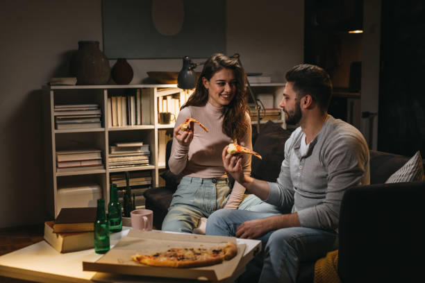 istock young couple spending evening at home 1338628629