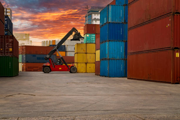istock Crane lifting up container in a port. 1338630861