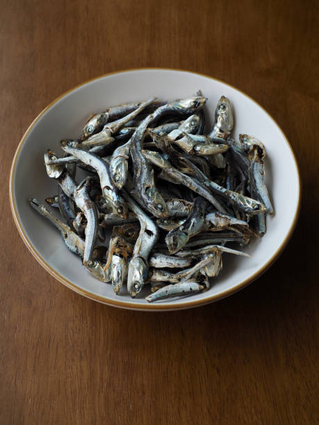 istock Dried anchovy background, food ingredient 1338630998