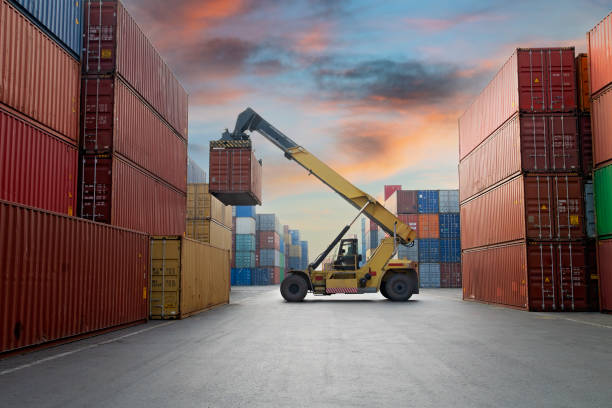 istock Crane lifting up container in a port. 1338632357