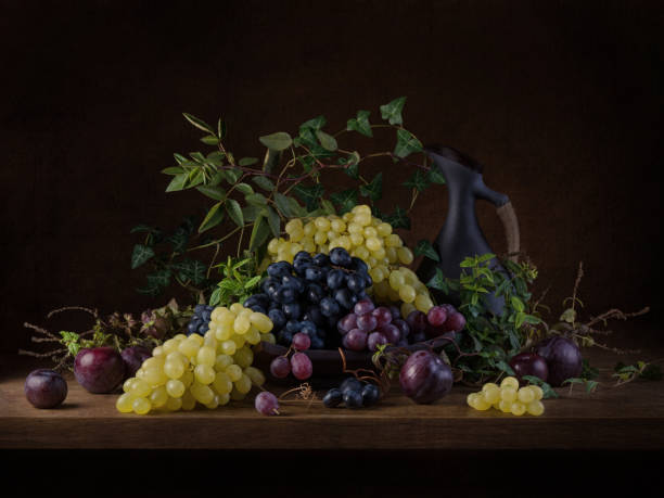 istock Still life with grapes and jug in dark moody style 1338633773