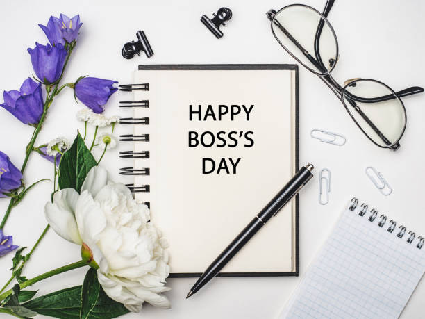 istock Happy Boss Day. Notepad and stationery lying on the table 1338639516