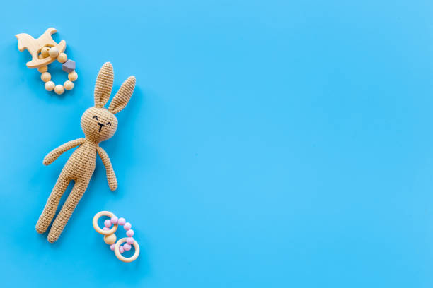 istock Baby wooden accessories with rabbit toy, top view 1338640149