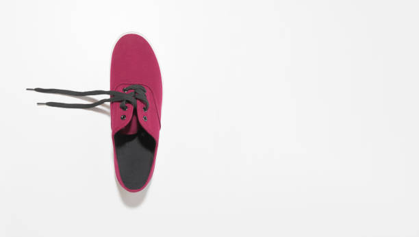 istock New sneaker. Maroon color. View from above. On white background. Copy space 1338640208