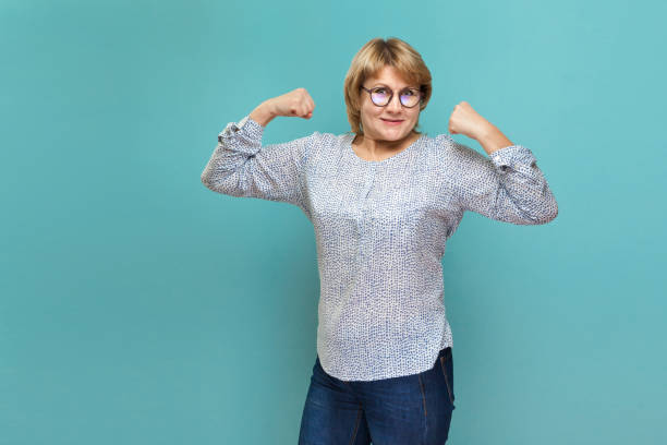 istock A woman on a blue background shows different emotions. 1338641017