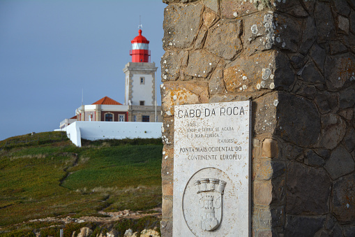 Cabo da Roca monument cross board and lighthouse. Cabo da Roca is the most western point of continental Europe in Portugal.