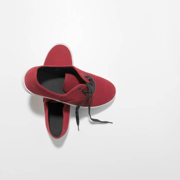 istock New sneakers. View from above. Maroon color.  On white background 1338642040