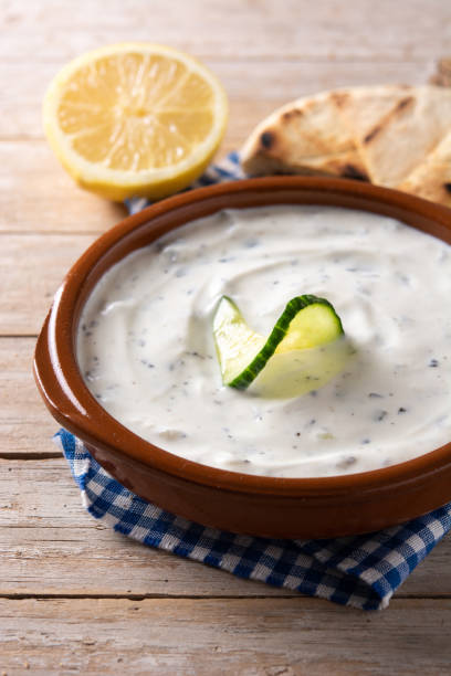 Traditional Greek Tzatziki Traditional Greek Tzatziki isolated on white background tzatziki stock pictures, royalty-free photos & images