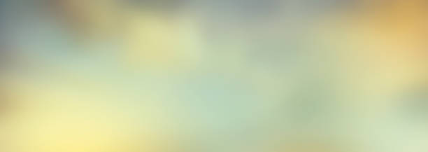 istock A blurred bokeh warm autumnal evening sunny sky background. 1338644856