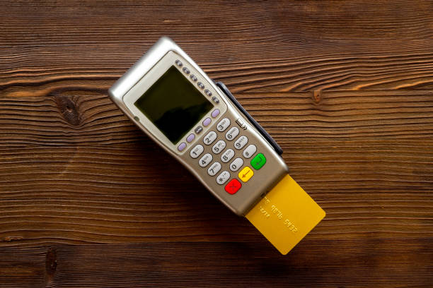 istock Payment transactions with pos credit card terminal, top view 1338645110