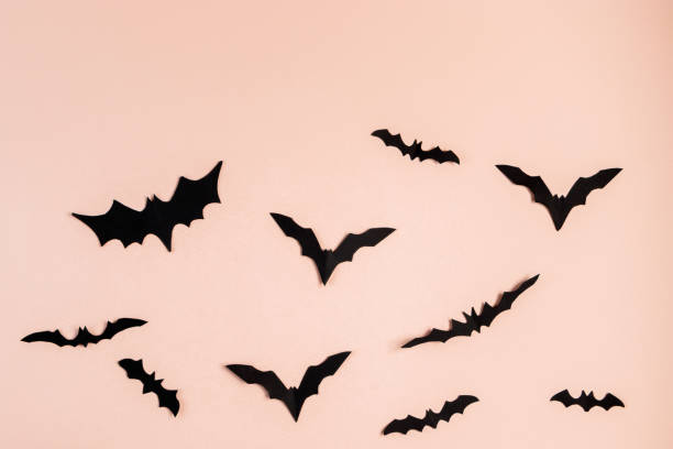 istock Halloween concept. Bats and spiders on pink background. Festive decorations. 1338650669