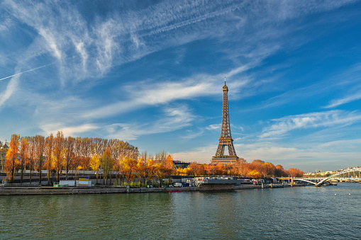 Paris France, city skyline at Eiffel Tower and Seine River Debilly Footbridge with autumn foliage season