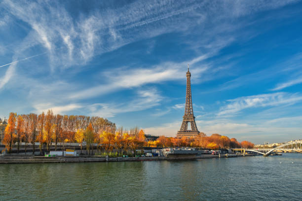 Paris France, city skyline at Eiffel Tower and Seine River Debilly Footbridge with autumn foliage season stock photo