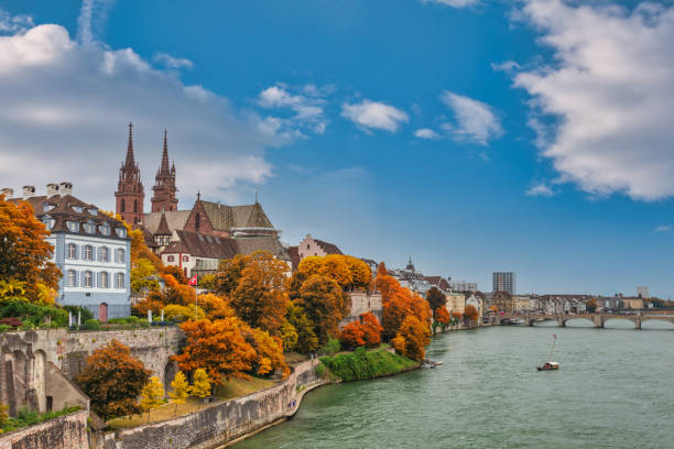 Basel Switzerland, city skyline at Rhine River with autumn foliage season stock photo