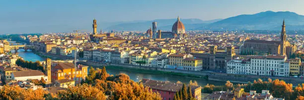 Photo of Florence Italy, panorama city skyline at Arno river with with autumn foliage season