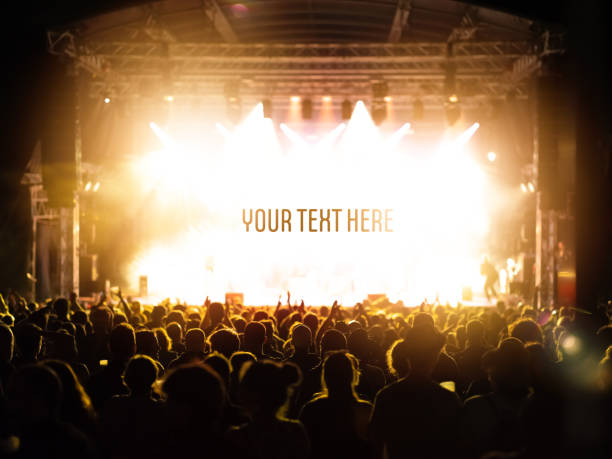 A concert stage with an audience A concert stage with an audience and a white space for text or logo concert stock pictures, royalty-free photos & images