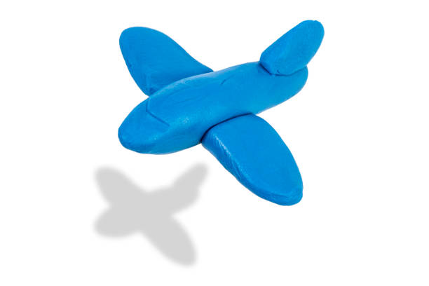 Children's plane of yellow blue color made of wood isolated on white background. Corncorn. The concept of children's toys. Retro Toys