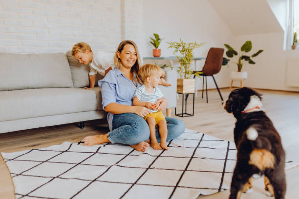 istock Little boys playing with mom and dog 1338655804