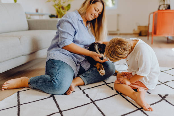 istock Little boys playing with mom and dog 1338655873