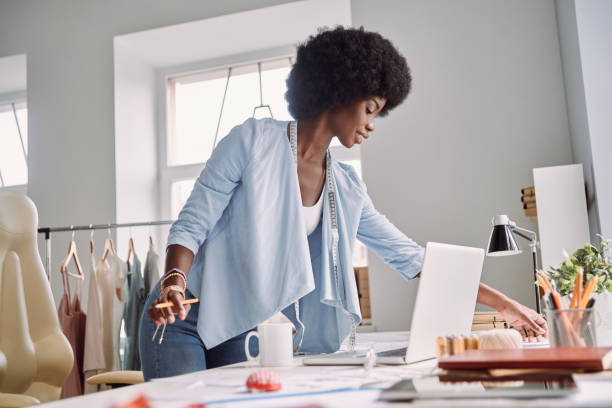 istock Beautiful young African woman working 1338655985
