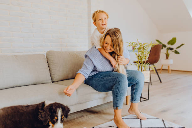 istock Little boys playing with mom and dog 1338656675