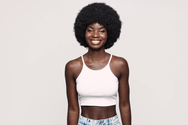 istock Beautiful young African woman looking at camera and smiling 1338656872