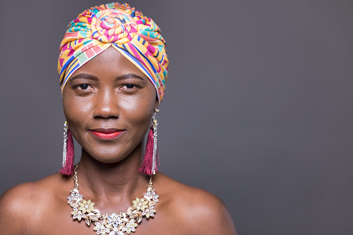 Portrait of a Ghanaian lady in a traditional headdress.