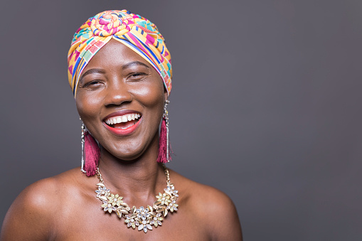 Portrait of a Ghanaian lady in a traditional headdress.