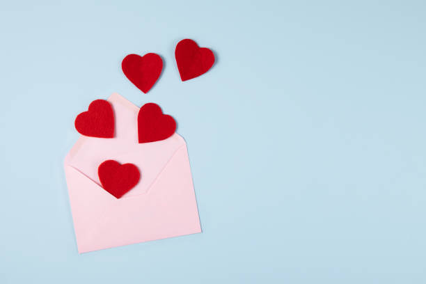 istock Envolope and Red Hearts on Blue Background 1338658121