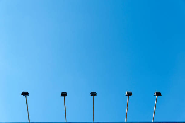 Lamps on blue background, lamppost stock photo