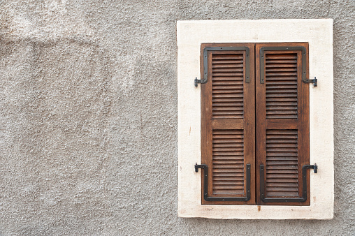 Closed brown wooden window, shutter