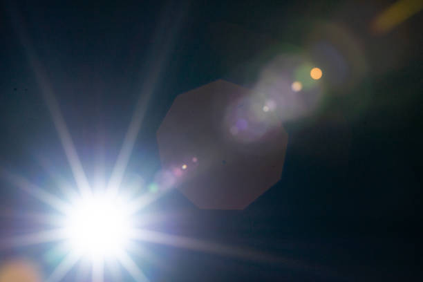 istock Sun flare on the black background 1338660387