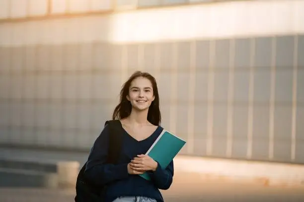 Portrait teenage student girl happy going to college or school