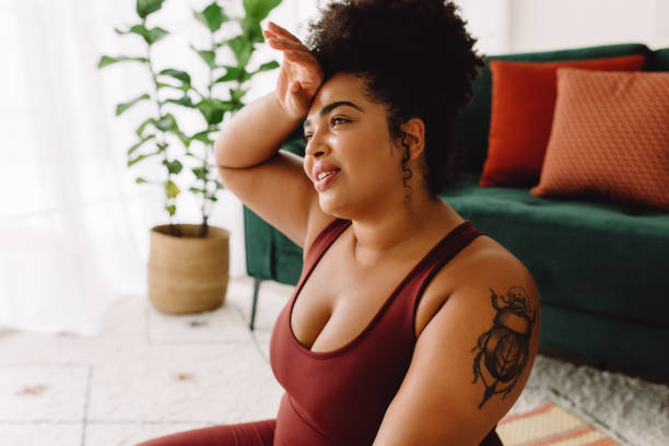 istock Body positive female tired after practicing yoga 1338667967