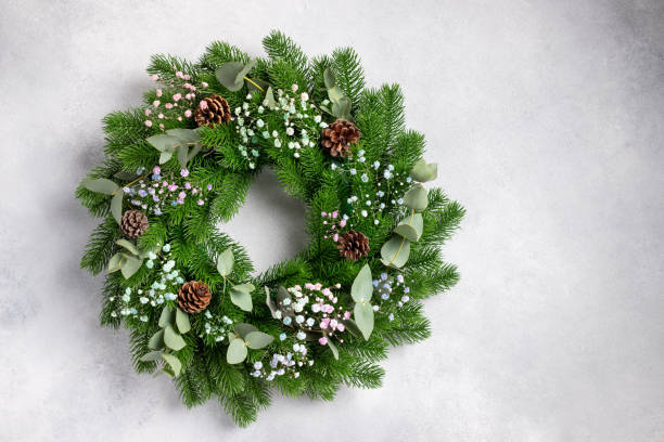 istock Christmas wreath on gray wall. copy space 1338669966