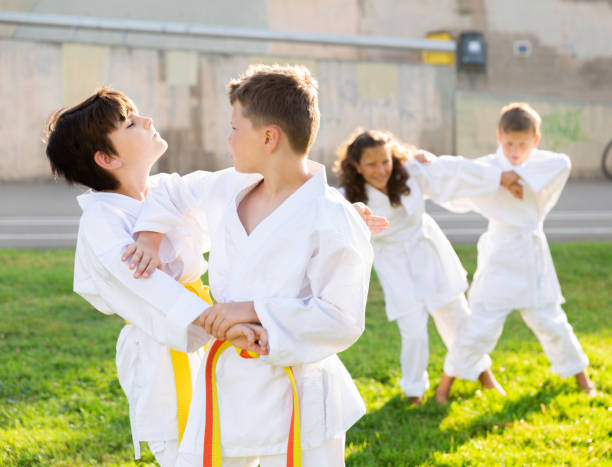 istock Kids in pairs sparring together 1338673769
