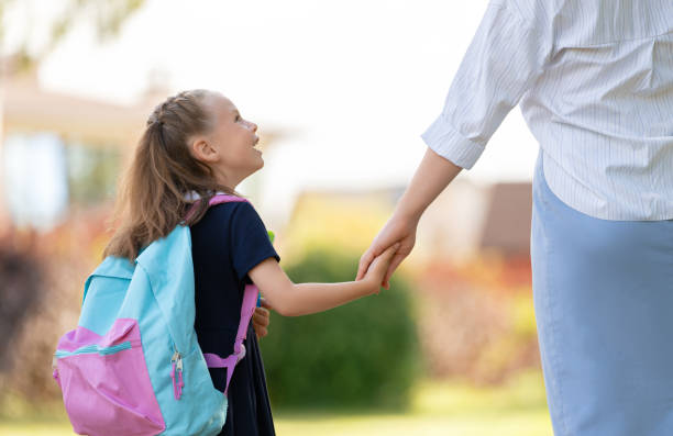 istock Parent and pupil going to school 1338674048
