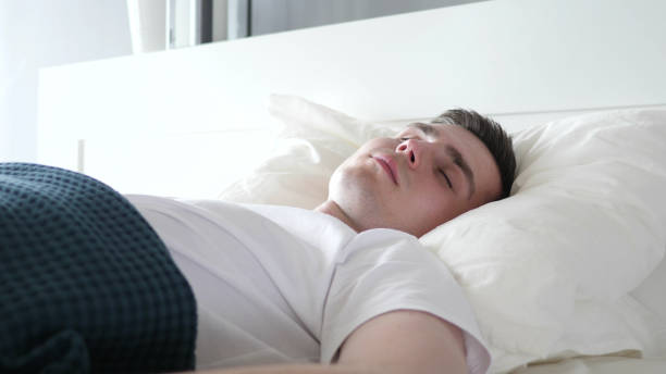 istock Close Up of Man Sleeping in Bed 1338681211