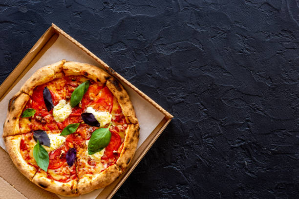 Margherita italian pizza with tomatoes cheese and basil, top view