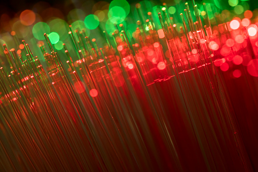 A DSLR close-up photo of fiber optics with beautiful bokeh. Space for copy.