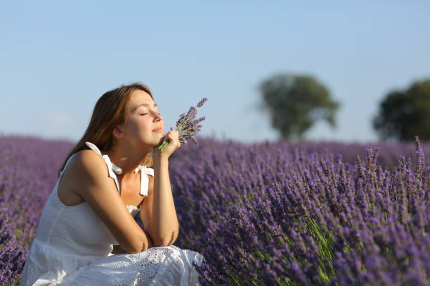 istock Woman resting and relaxing in lavender field 1338690197