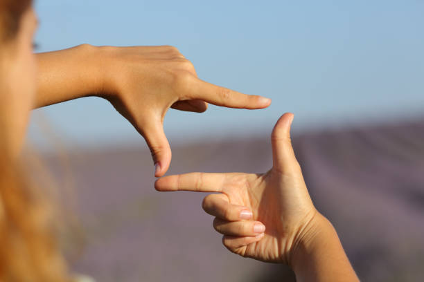 Woman hands framing in lavender field