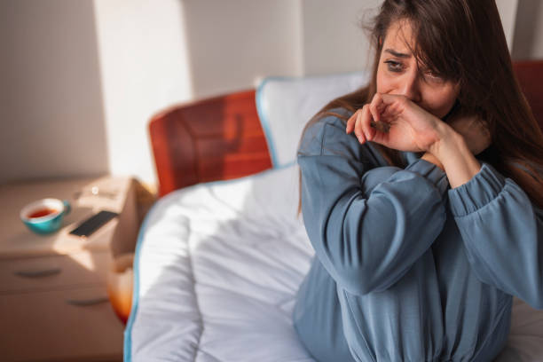 istock Woman crying in bed with smeared make up 1338695430