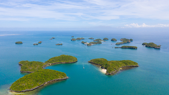 Aerial view of Small islands with beaches and lagoons in Hundred Islands National Park, Pangasinan, Philippines. Famous tourist attraction, Alaminos. Summer and travel vacation concept.