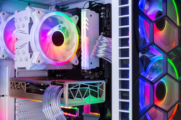 istock Inside view of custom colorful illuminated bright rainbow RGB LED gaming pc. Computer power hardware and technology concept background 1338699020
