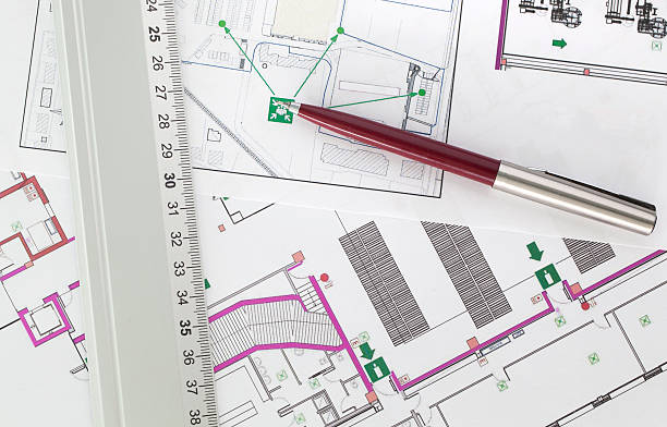 istock Prints of several evacuation plans with a pen and a ruler 133869955