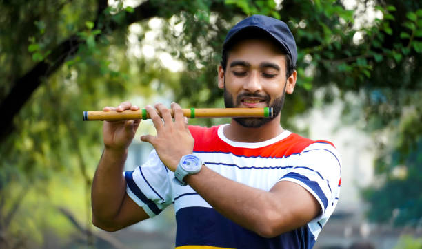 istock playing bansuri flute indian wind instrument 1338700854