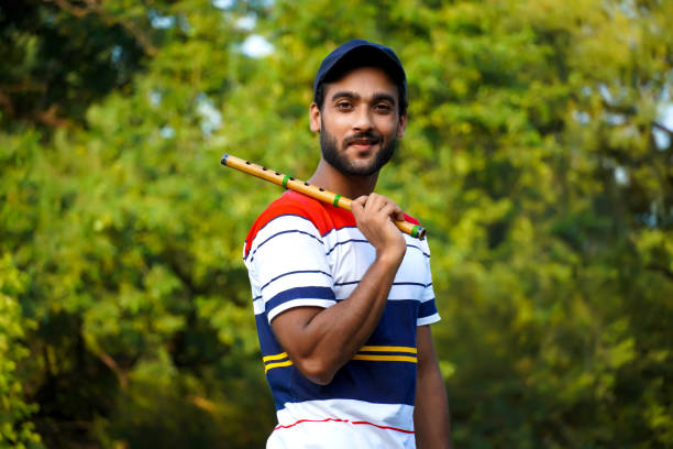 istock man with bansuri flute indian wind instrument 1338700868