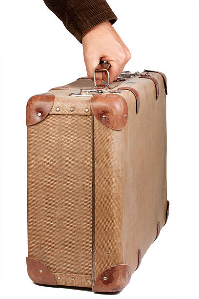 istock Vintage brown suitcase isolated over white background 133870157